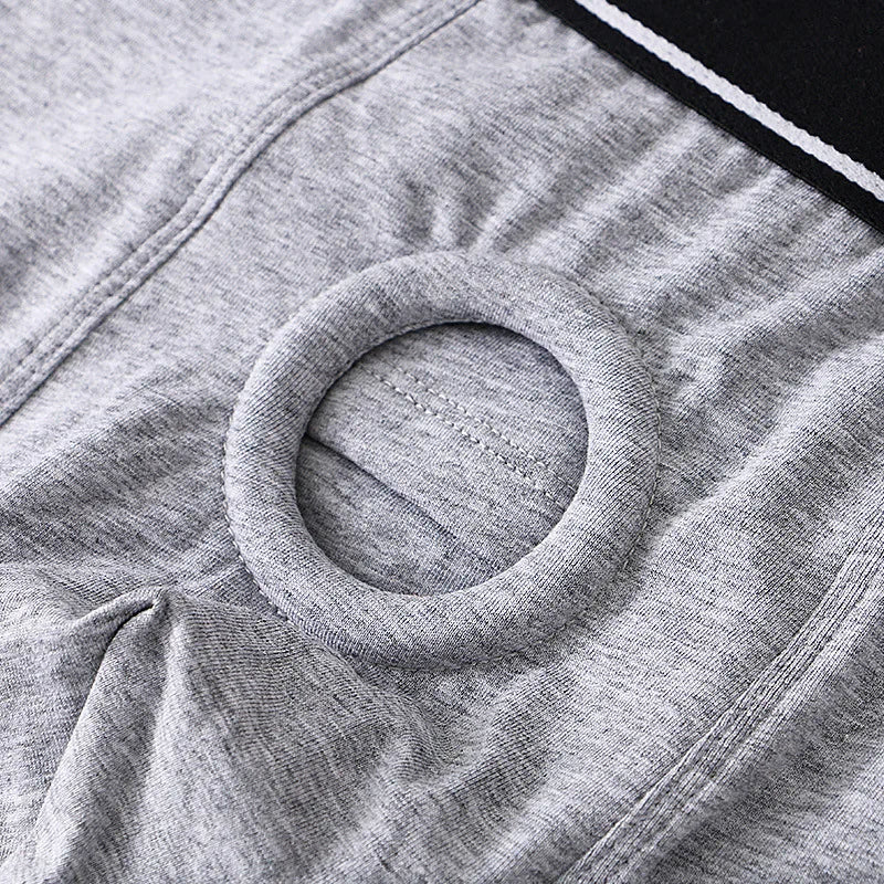 Close-up of gray fabric with a circular pattern to hold a dildo for pegging