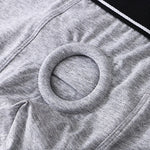Close-up of gray fabric with a circular pattern to hold a dildo for pegging