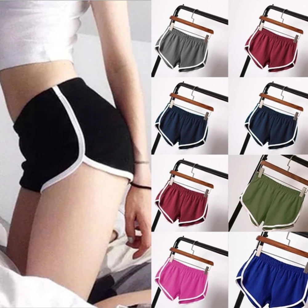 Black athletic shorts with white trim on a person, followed by a grid of colorful shorts on hangers.