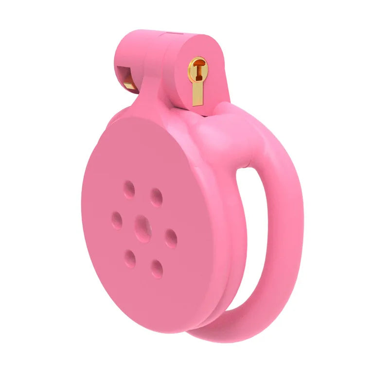 Pink flat silicone chastity cage with vented round cover and built-in lock on white background