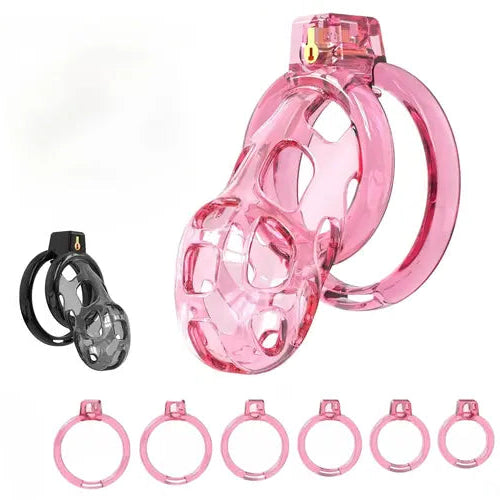 Pink translucent silicone male chastity device with a large ring and six matching pink rings, shown alongside a black version of the device on a white background.