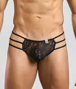 Front view of a men's black floral lace thong with three narrow straps at each hip.