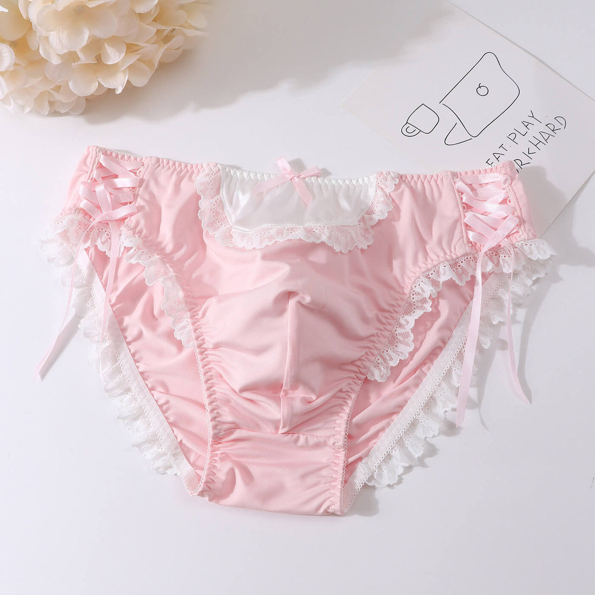 Men's lace-trim briefs with ribbon-laced sides.