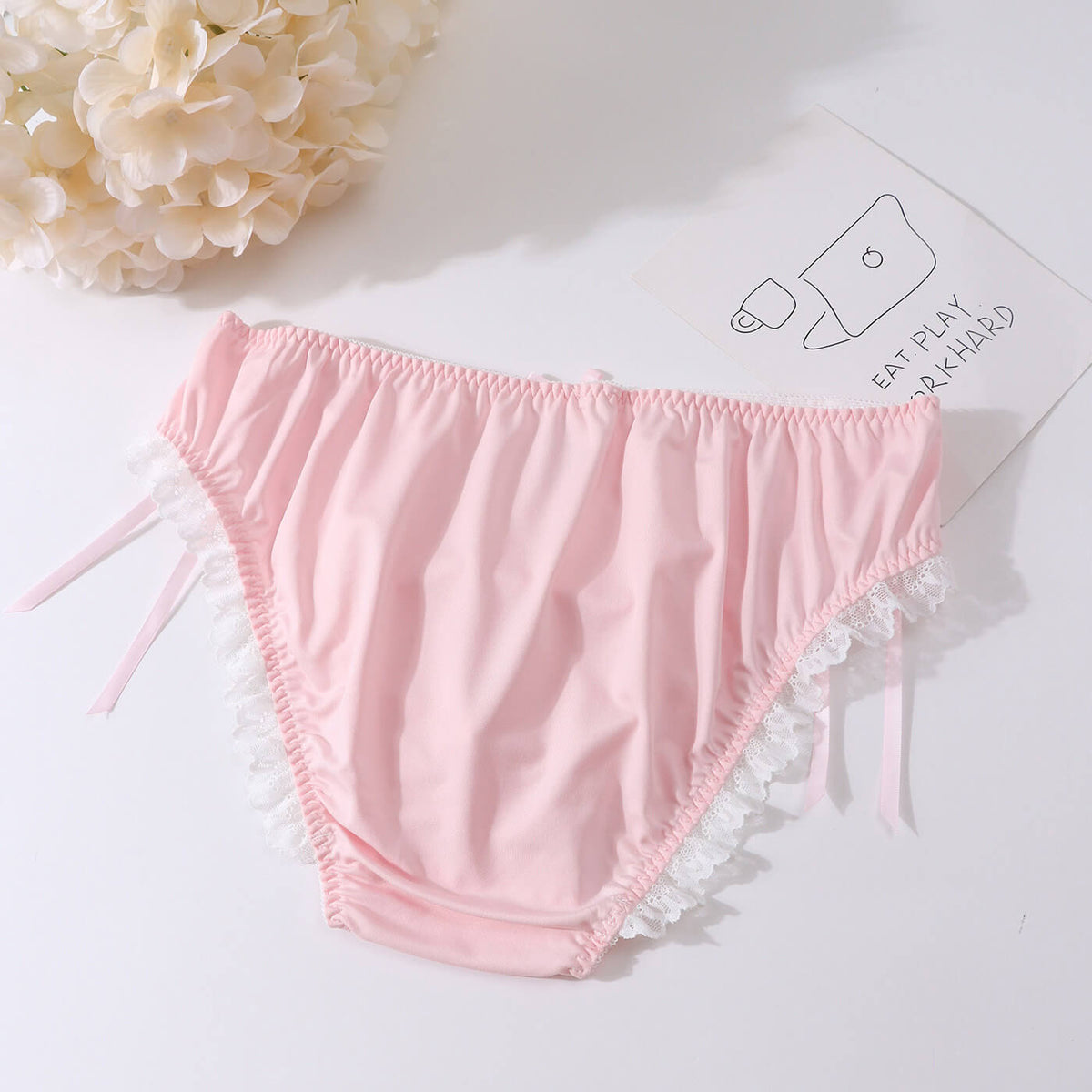 Men's lace-trim briefs with ribbon-laced sides.