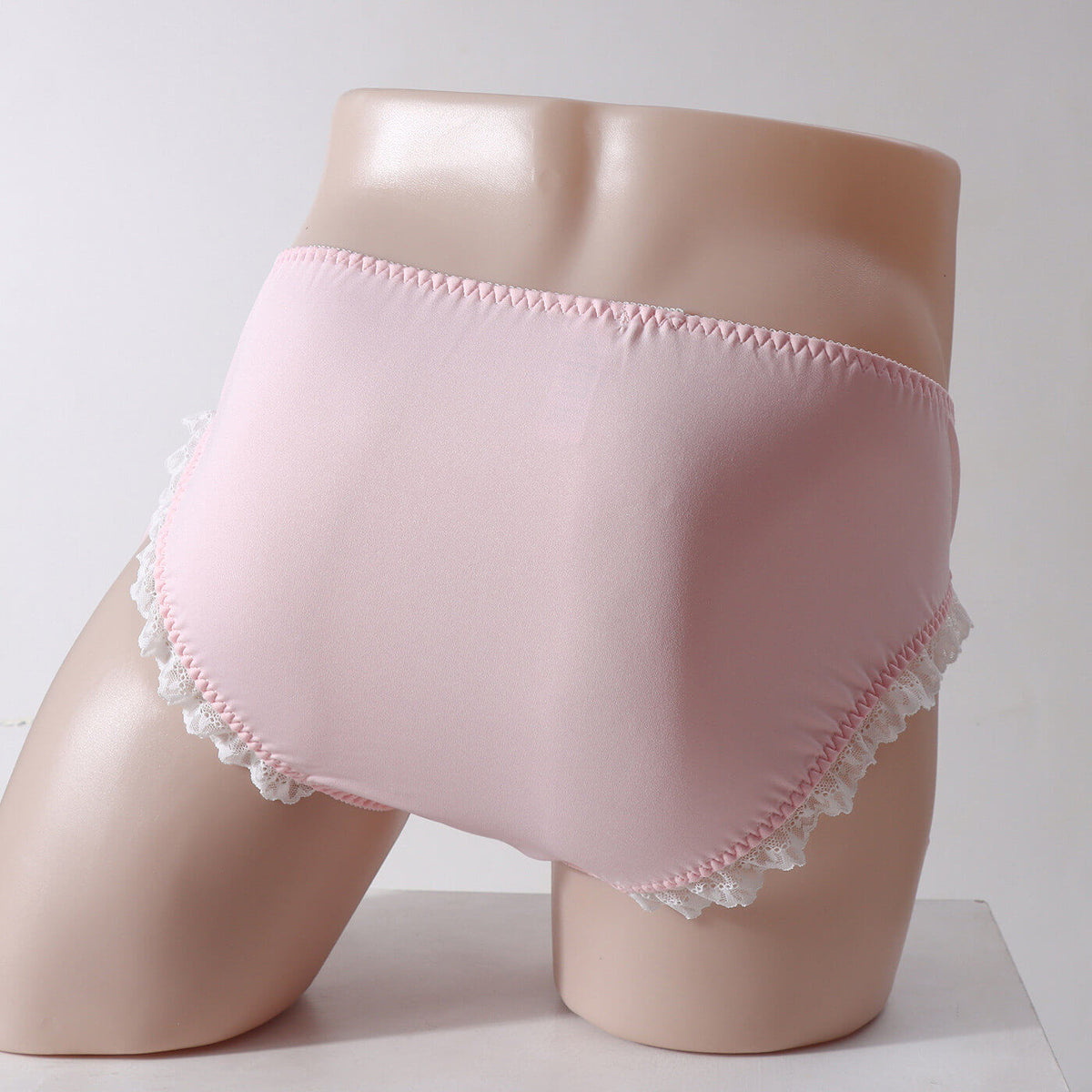 Men's lace-trim briefs with ribbon-laced sides.