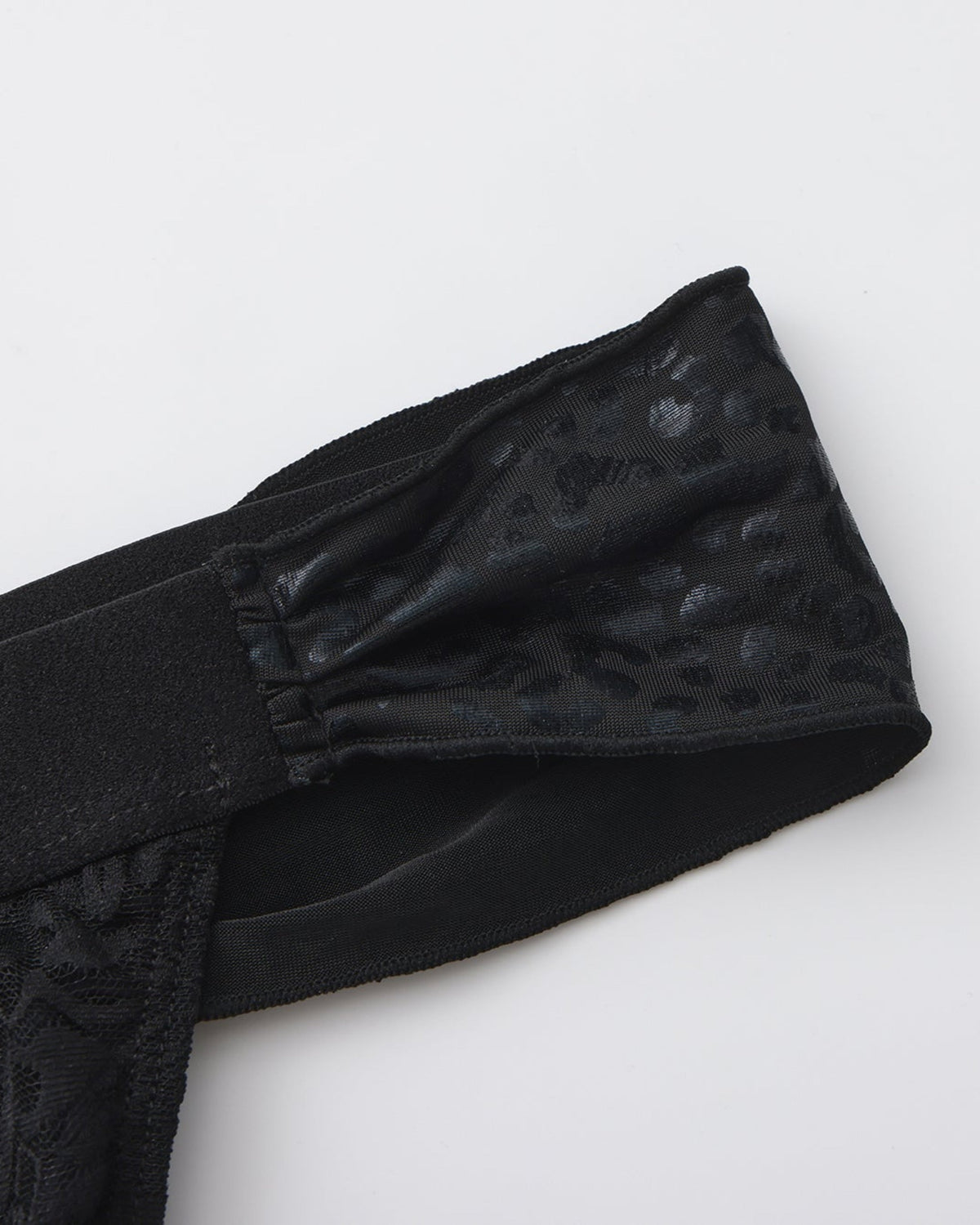 Men's black lace thong with leopard-pattern scarf ties.